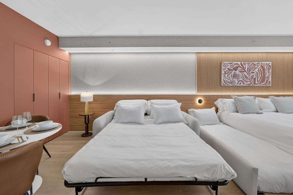 Luxury studio with sofa, king bed and dining table