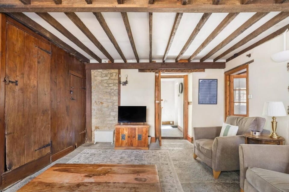 Beamed living room with characterful timber and comfy seating