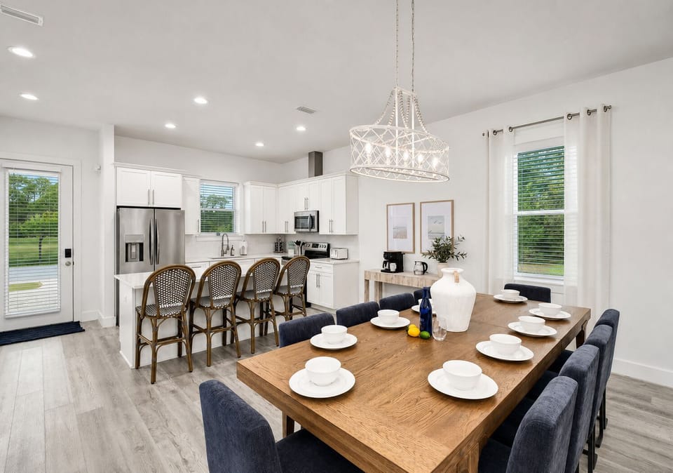 1st Floor - Open-concept gathering space with dining for 10, island seating for 4, and comfortable living-room seating—ideal for shared meals, celebrations, and group time.