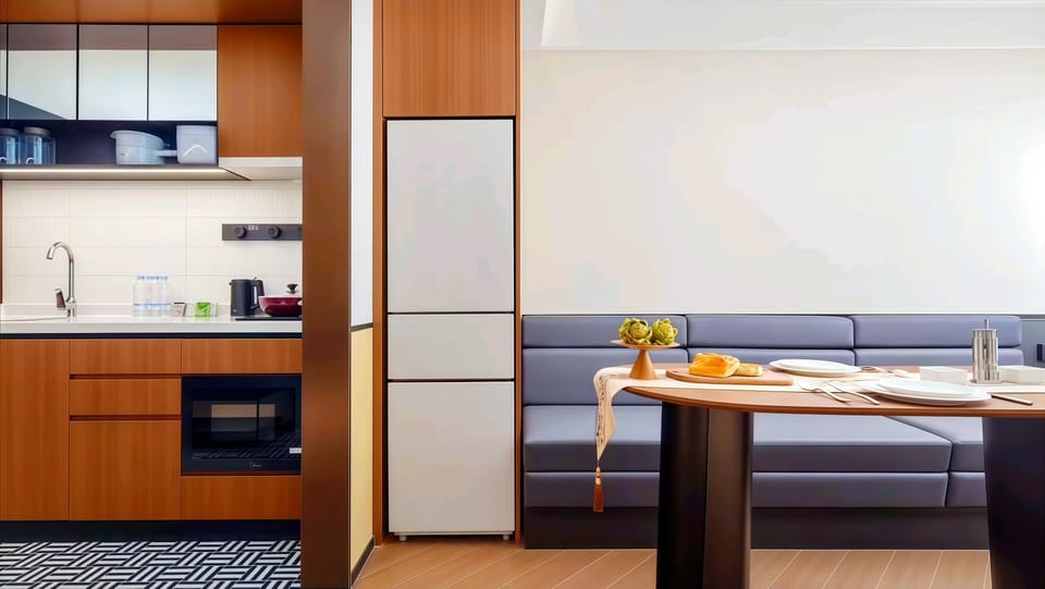 Luxury Suite, City View | Private kitchen | Mini-fridge, shared microwave, eco-friendly cleaning products, freezer
