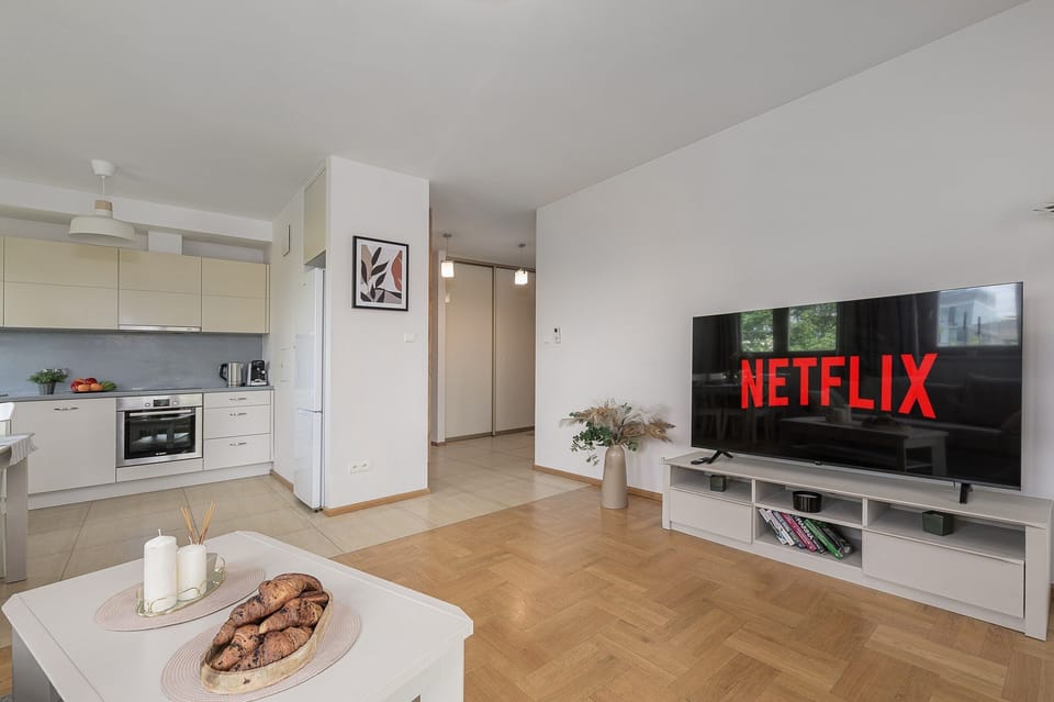 Deluxe Apartment, 2 Bedrooms, Courtyard View | Living area | 30-inch TV with satellite channels, Netflix, streaming services