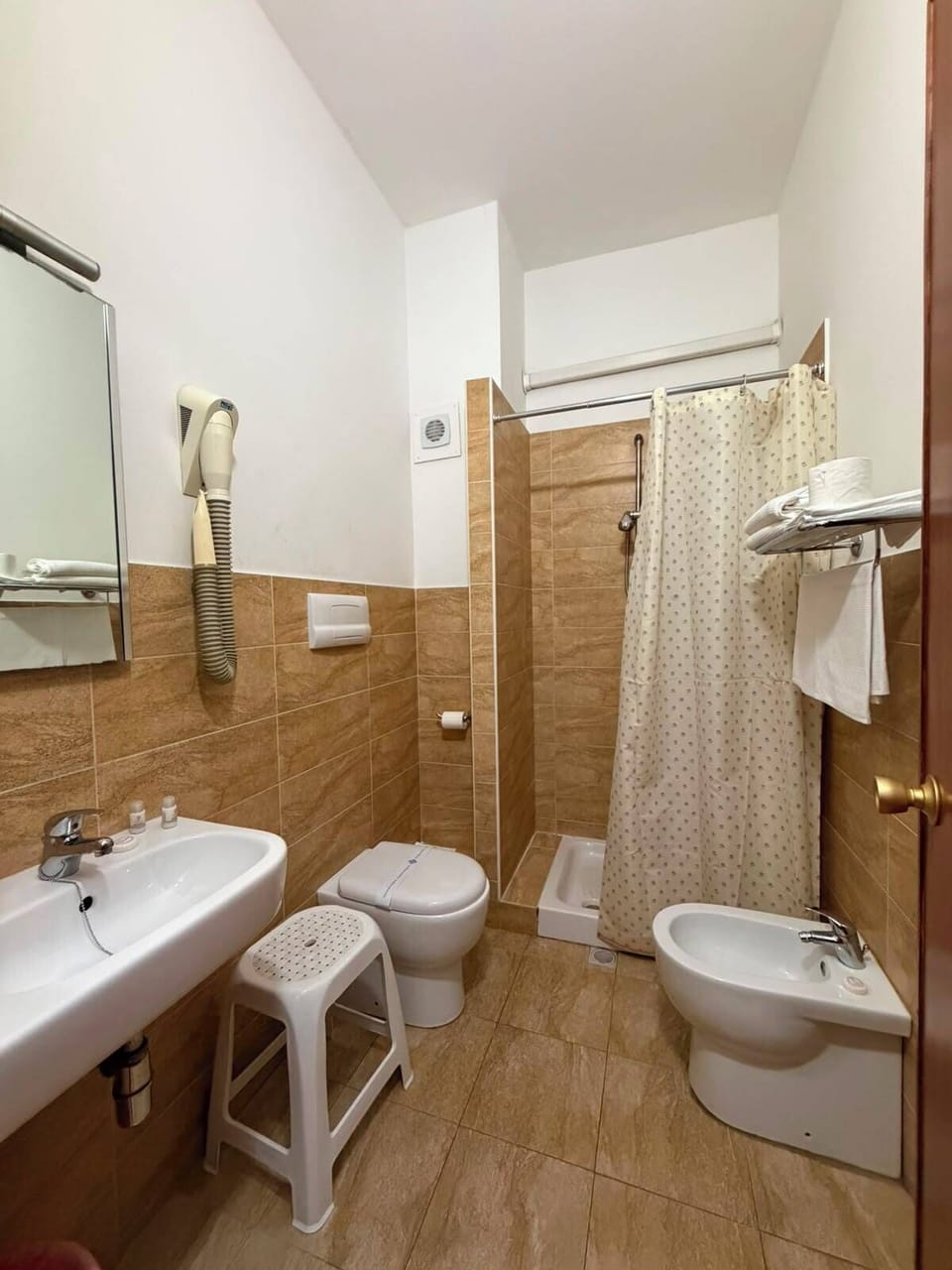 Hair dryer, towels, soap, shampoo