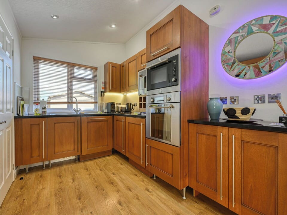 Furniture, Cabinetry, Flooring, Kitchen, Interior Design, Wood, Kitchen Appliance, Countertop, Major Appliance, Home Appliance
