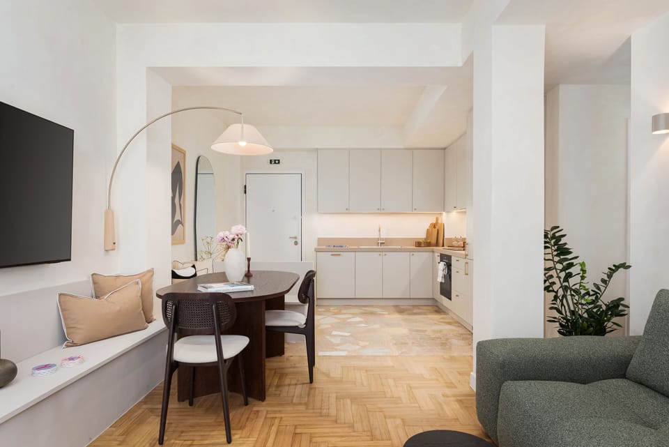 Deluxe Apartment | Living area | 55-inch Smart TV with satellite channels