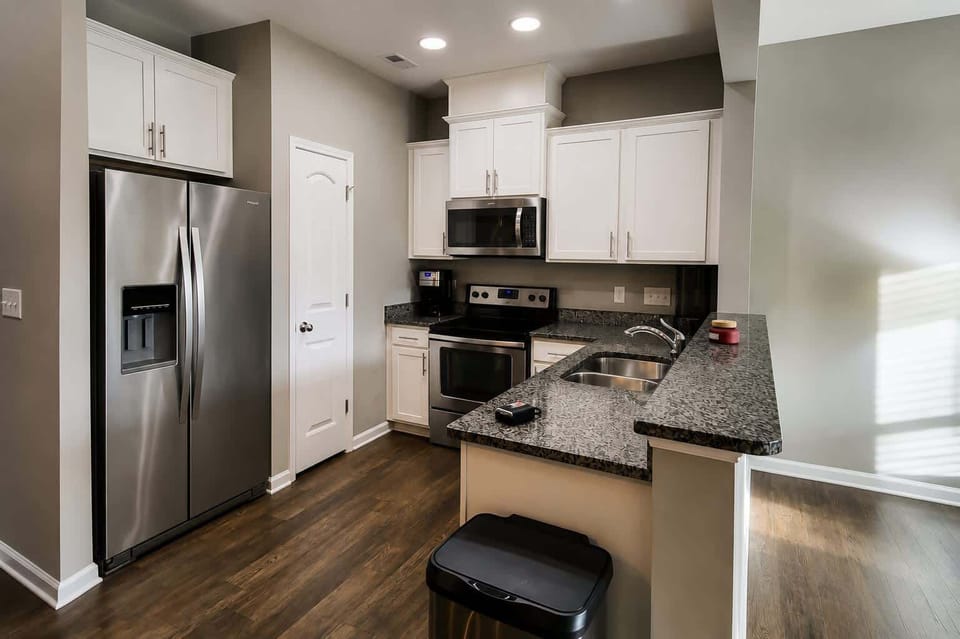 Granite kitchen with stainless appliances