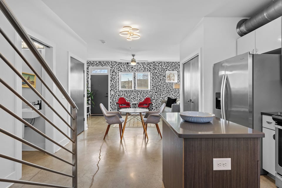 This dining area offers a modern table and seating with an open, airy layout.
