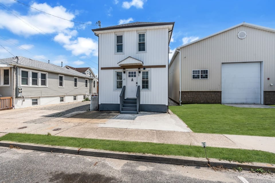 Charming two-story home with private entry and clean curb appeal
