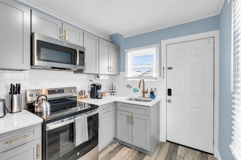 Bright modern kitchen with stainless appliances and stylish finishes