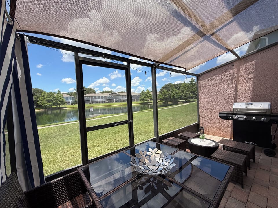 Private screened in and shaded patio with beautiful view of the lake