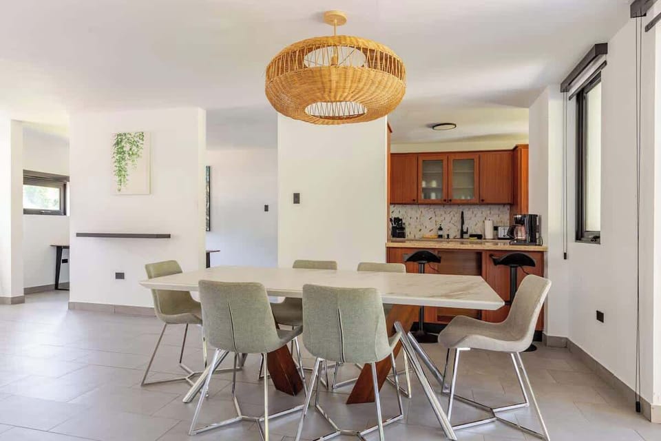 Whether you're hosting colleagues, enjoying family dinners, or planning the next day's agenda, this spacious dining area brings everyone together in comfort. The open-concept layout keeps conversation flowing between the kitchen and living spaces.