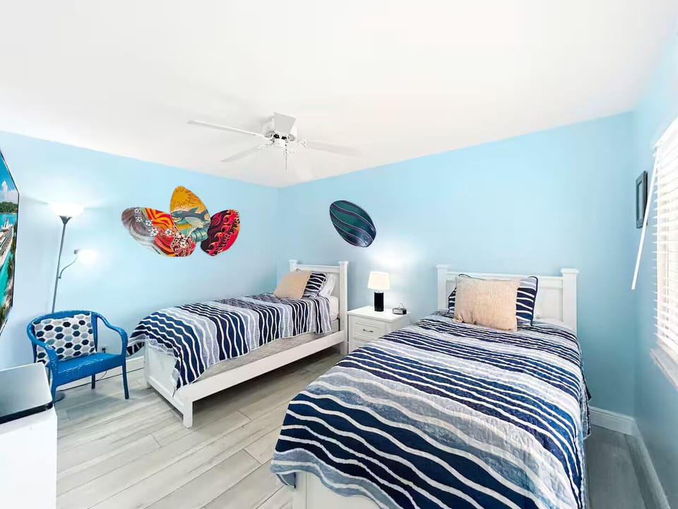 2nd bedroom with 2 beds and linens provided.