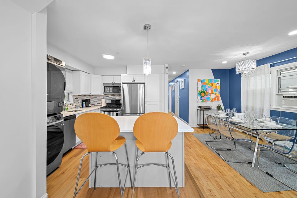 Bright modern kitchen with island seating and stylish dining area