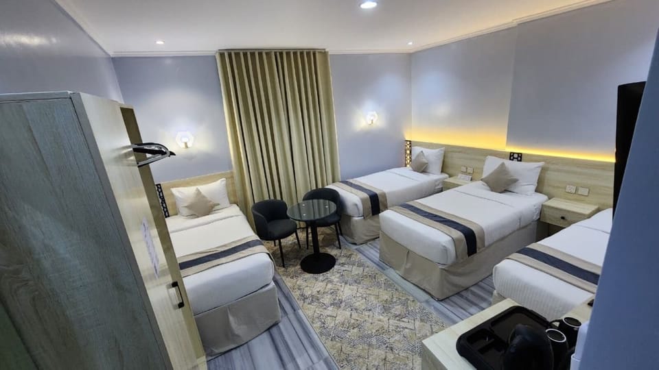 Deluxe Quadruple Room | Premium bedding, minibar, laptop workspace, WiFi (free)