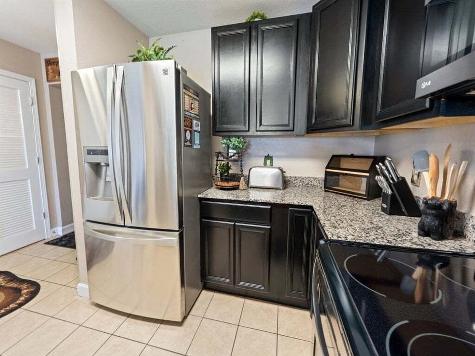 Modern kitchen with granite counters and stainless steel appliances