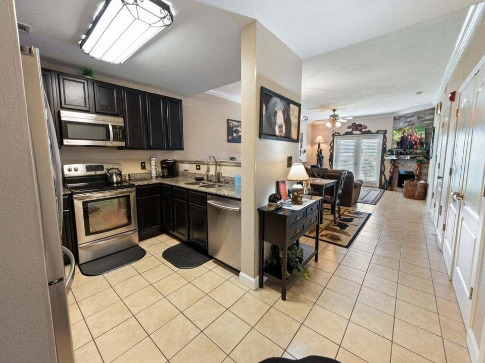 Open kitchen with granite counters and a bright, cozy living space