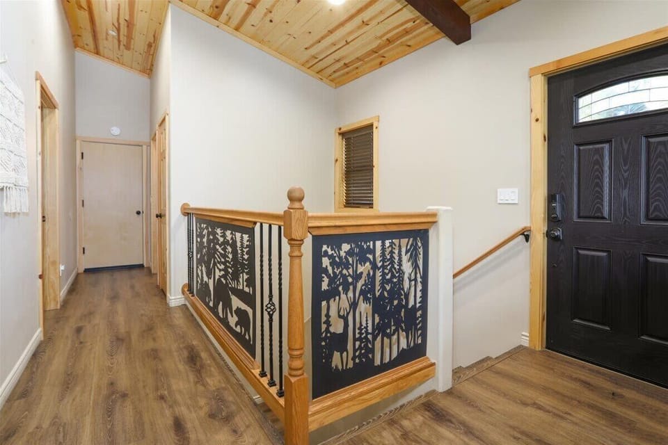 Custom woodland details carry the cabin theme throughout the home.