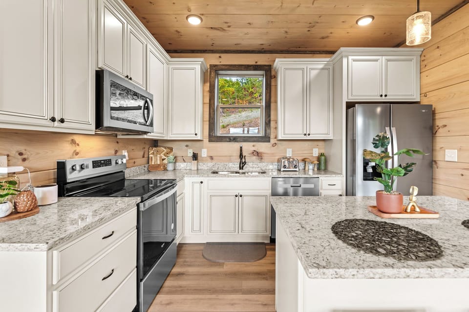 Bright rustic-modern kitchen with island, granite counters & stainless appliances