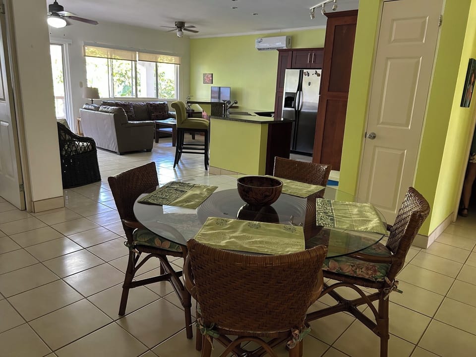 Dining area towards kitchen and living area