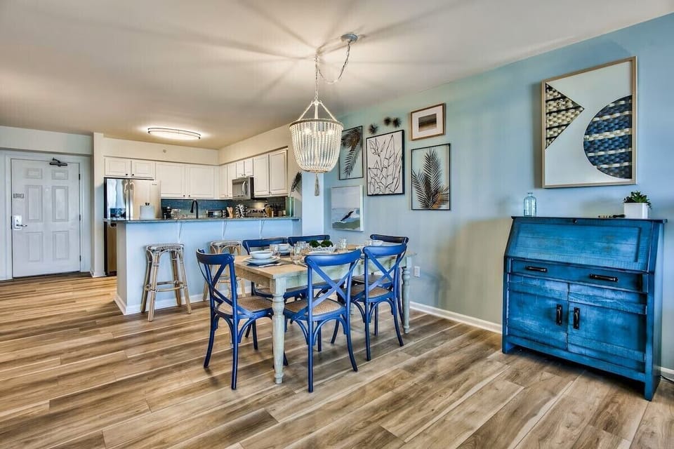 Dinning table and bar stools at the island for eating.