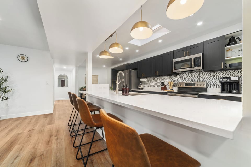Gather around the oversized kitchen island with seating for 4, perfect for morni