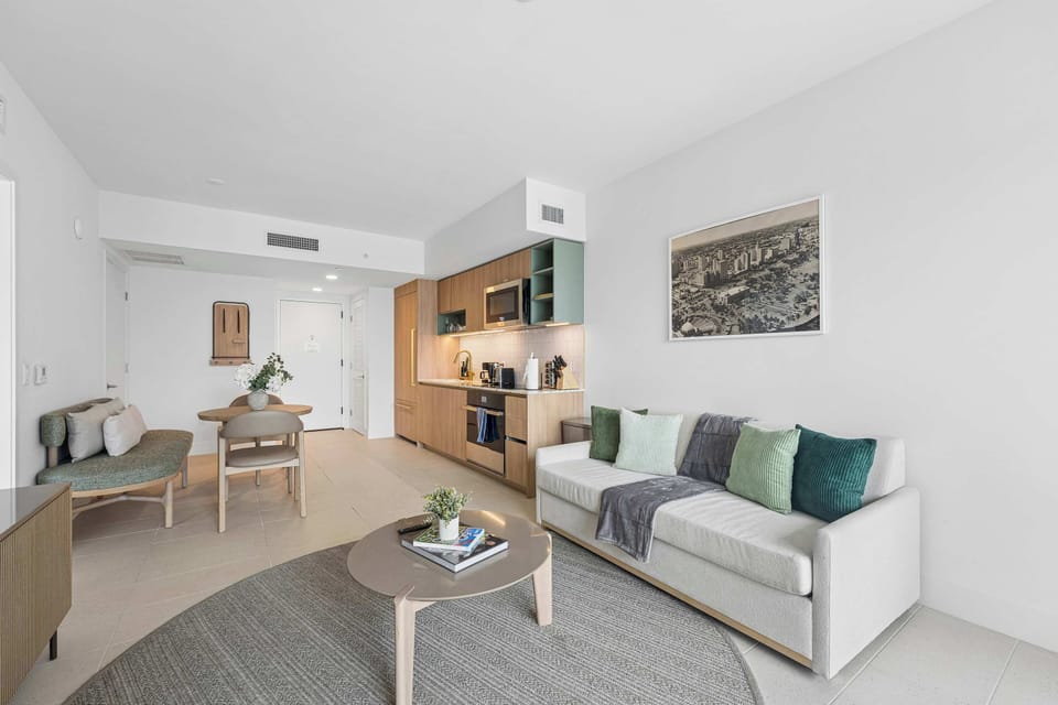 Cozy living room with a comfortable sofa bed and chic decorative accents.