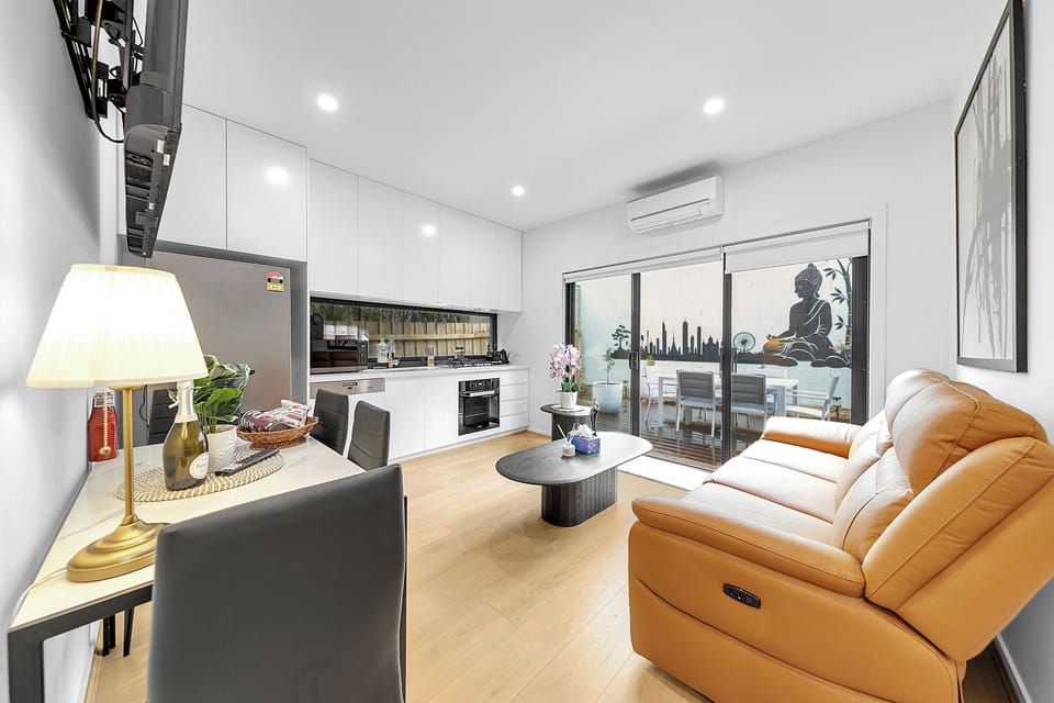 Bright modern stay with sleek kitchen, comfy sofa, and private balcony