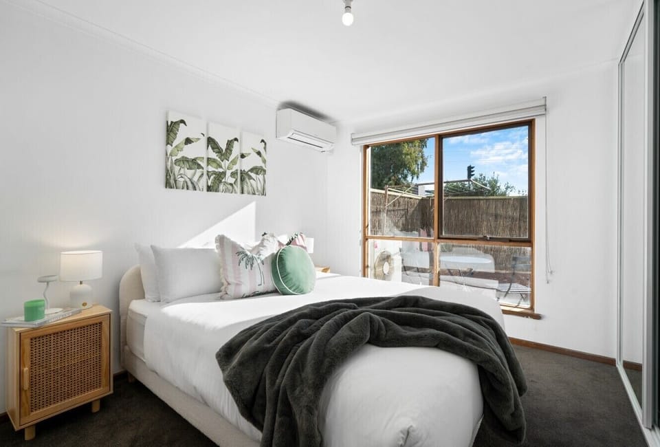 The queen bed, mirrored wardrobes and calming décor provide a welcoming retreat after a day exploring the city.