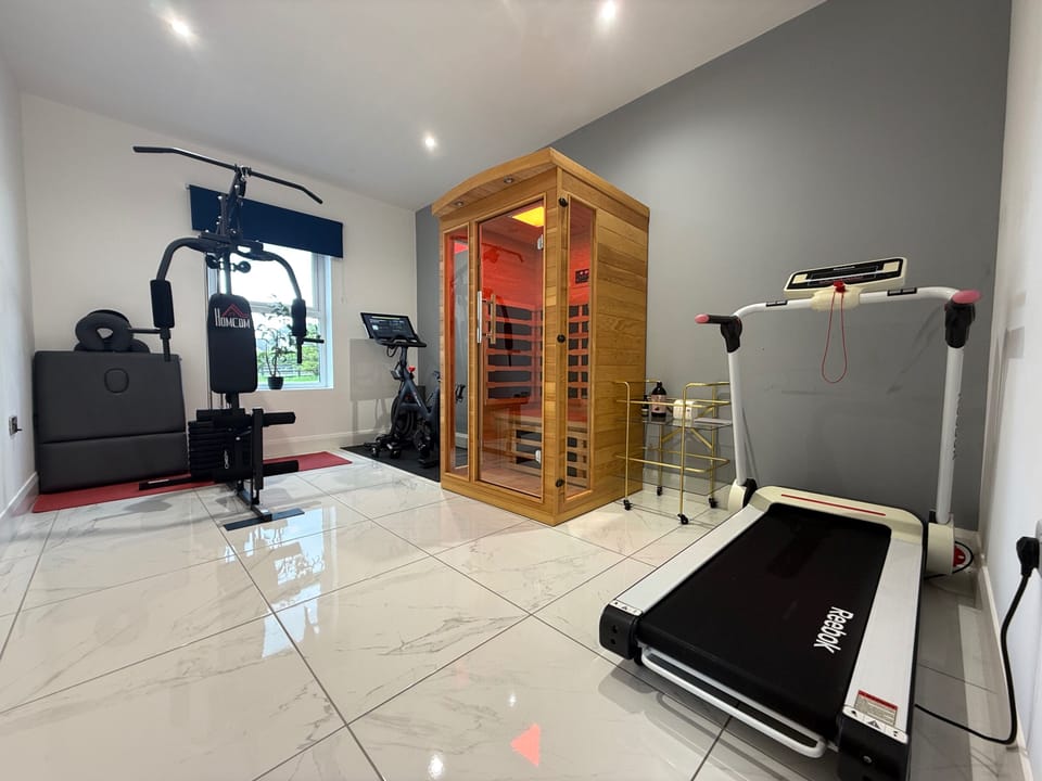 Home gym, infrared sauna, reebok tredmill and peleton, massage table foldable 