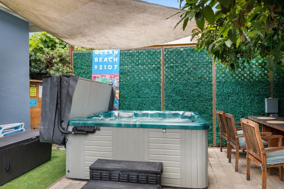 Soak and unwind in your private hot tub beneath the shade of the avocado tree.