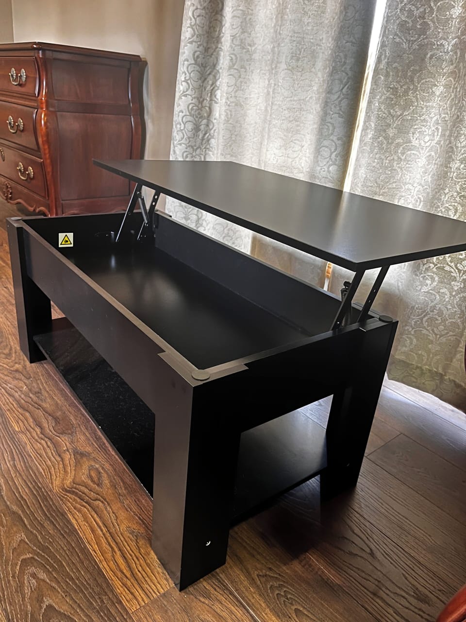 A coffee table that converts to a desk.