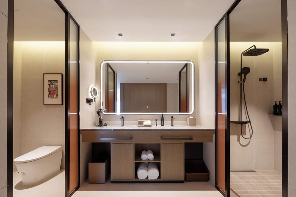 Shower, hair dryer, slippers, towels