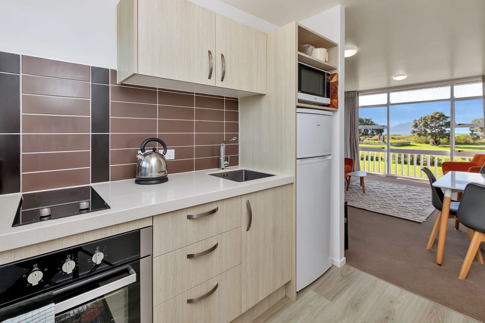Apartment, Balcony, Sea View | Private kitchen | Full-size fridge, microwave, oven, stovetop