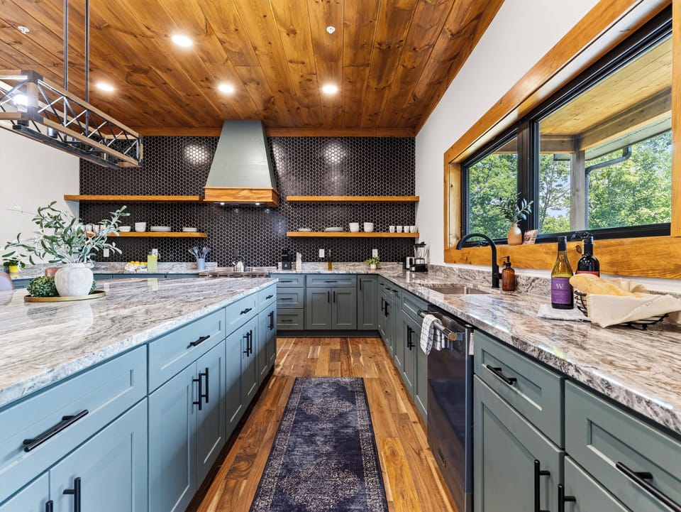Fully equipped kitchen detailing the extensive cabinetry space and stainless steel appliances.