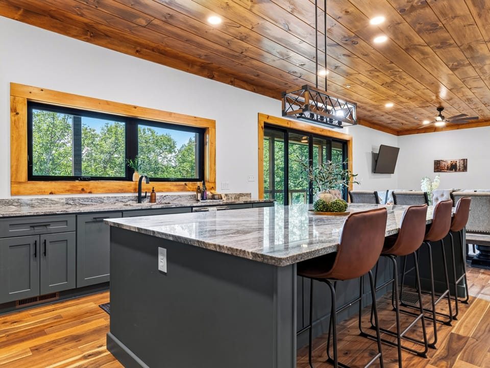 Fully equipped kitchen detailing the extensive cabinetry space and stainless steel appliances.