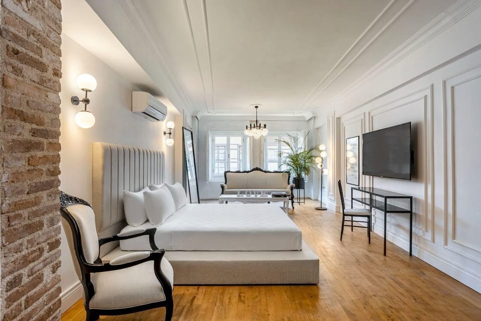 Deluxe Suite, City View | Desk, laptop workspace, WiFi (free), individually decorated