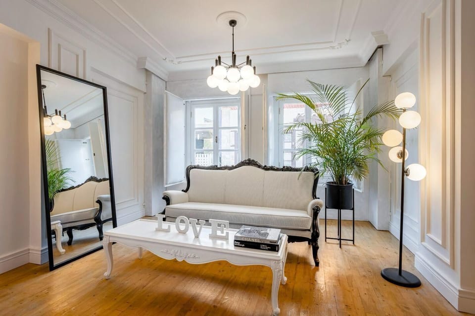 Deluxe Suite, City View | Living area | 85-cm TV with satellite channels