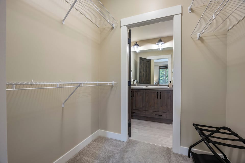 The master bedroom closet has plenty of space for storage. 