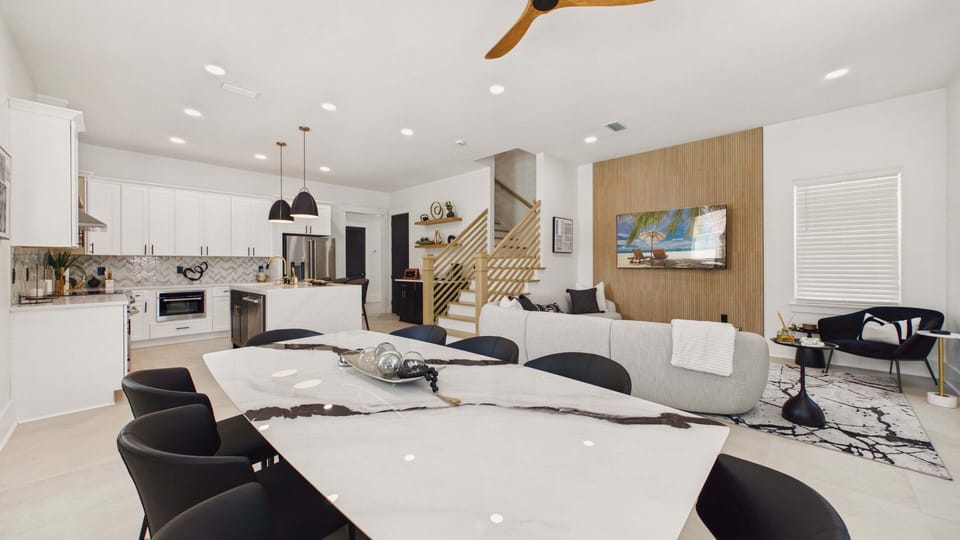 Dining table off from the living area with seating for 8