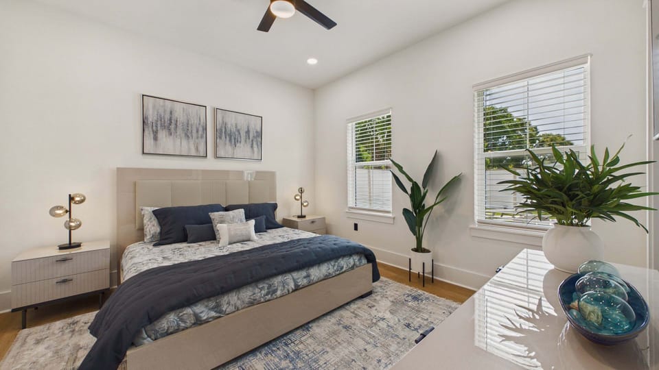 Primary bedroom with comfy king bed and TV + ensuite bathroom (sleeps 2)