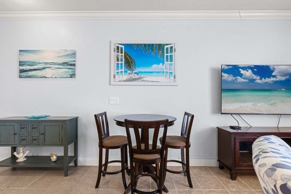 Dining table in common area with seating for 3