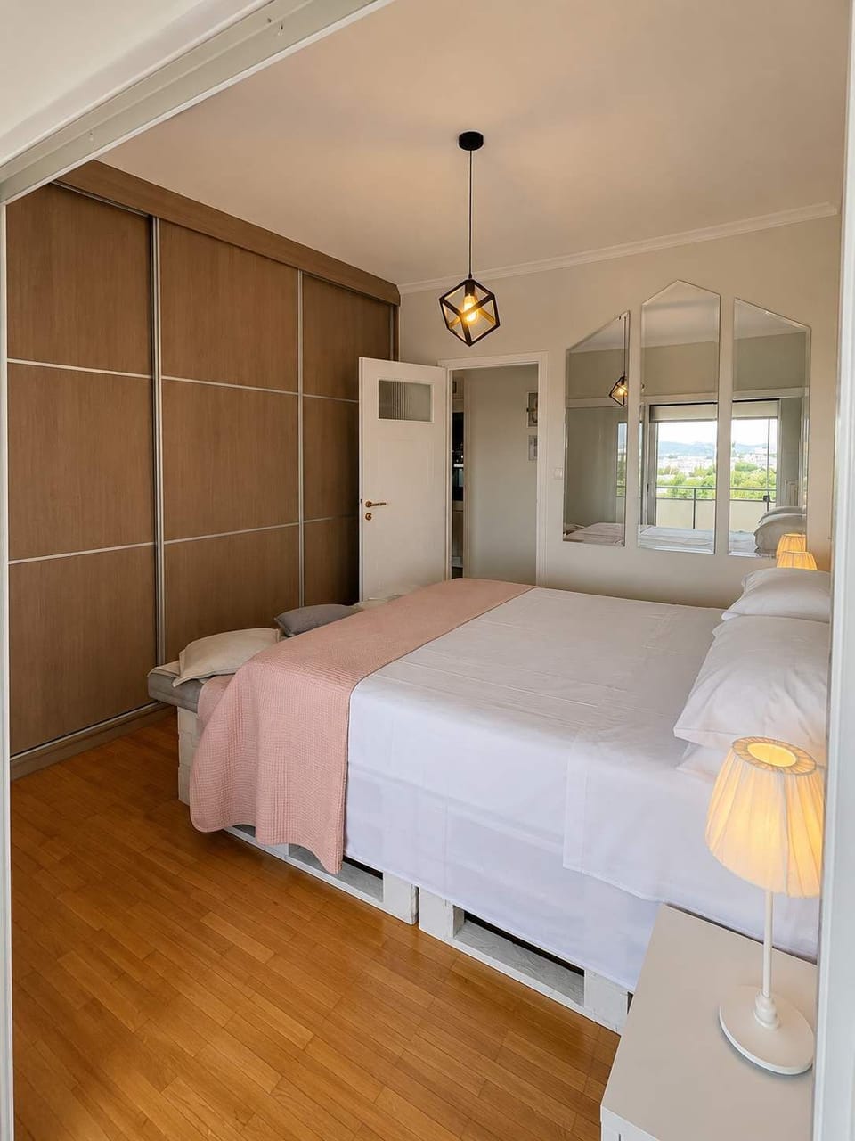 Spacious bedroom with mirrored wardrobes and plenty of storage