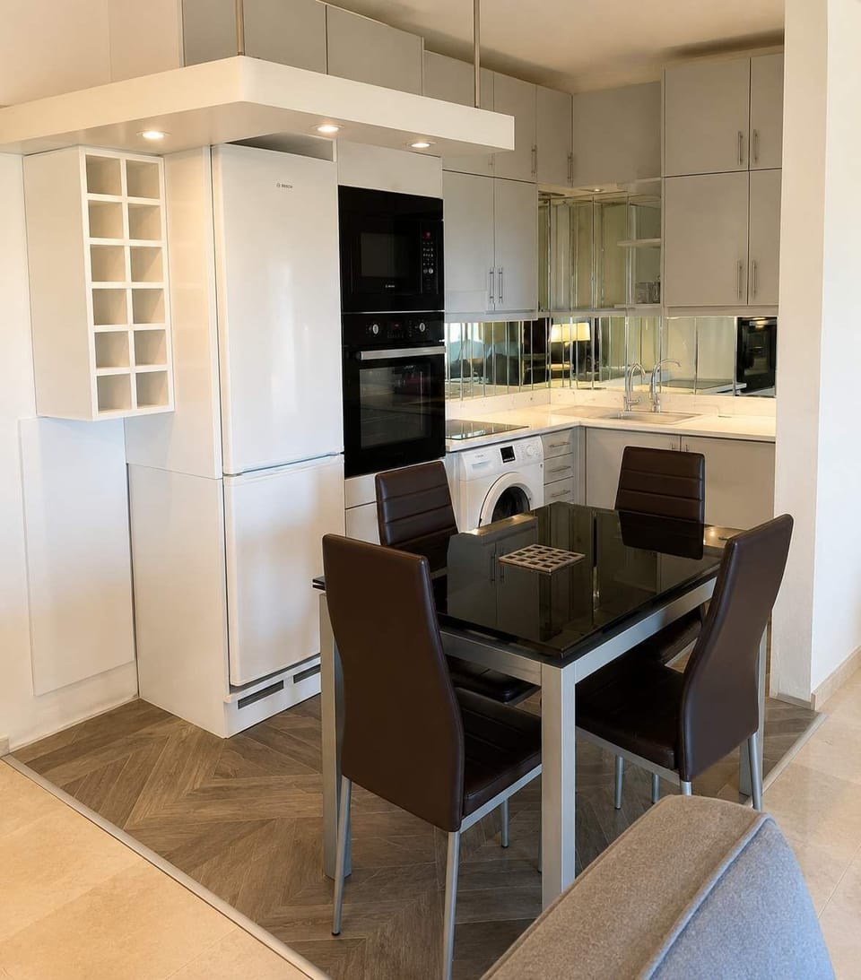 Modern dining area next to the fully equipped kitchen