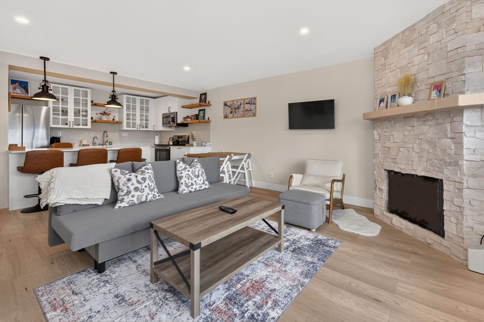 Unwind in your bright open-concept living area with modern kitchen, and comfortable seating create the perfect home base for your getaway.