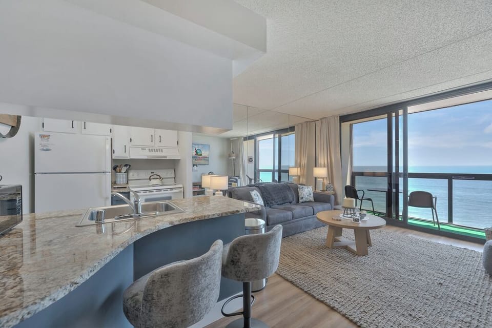 Keep the chef company at the breakfast bar while taking in the beautiful open-concept views.
