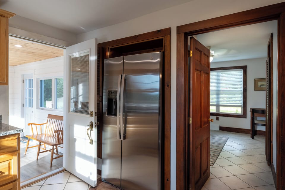 welcoming kitchen with stainless steel appliances.