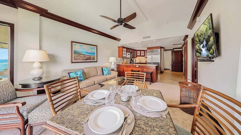 Relax in your open-concept living space with high ceilings, a full kitchen, and ocean views—perfect for unwinding after a day of island adventures.