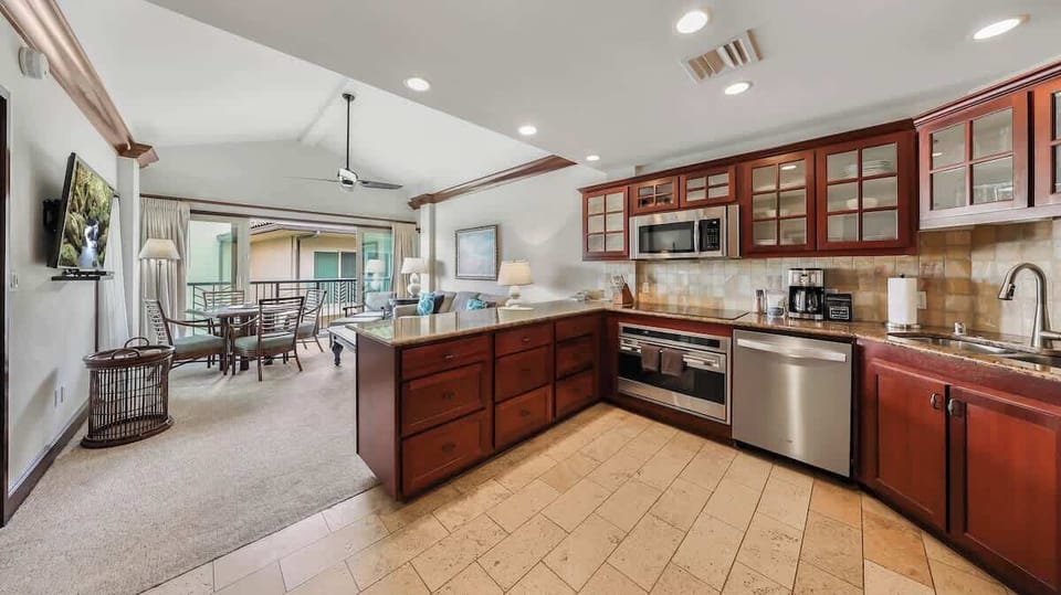 Step into your open-concept haven where a gourmet kitchen flows seamlessly into inviting living and dining spaces. Gleaming cherry cabinetry, stainless steel appliances, and a private balcony await your coastal getaway.