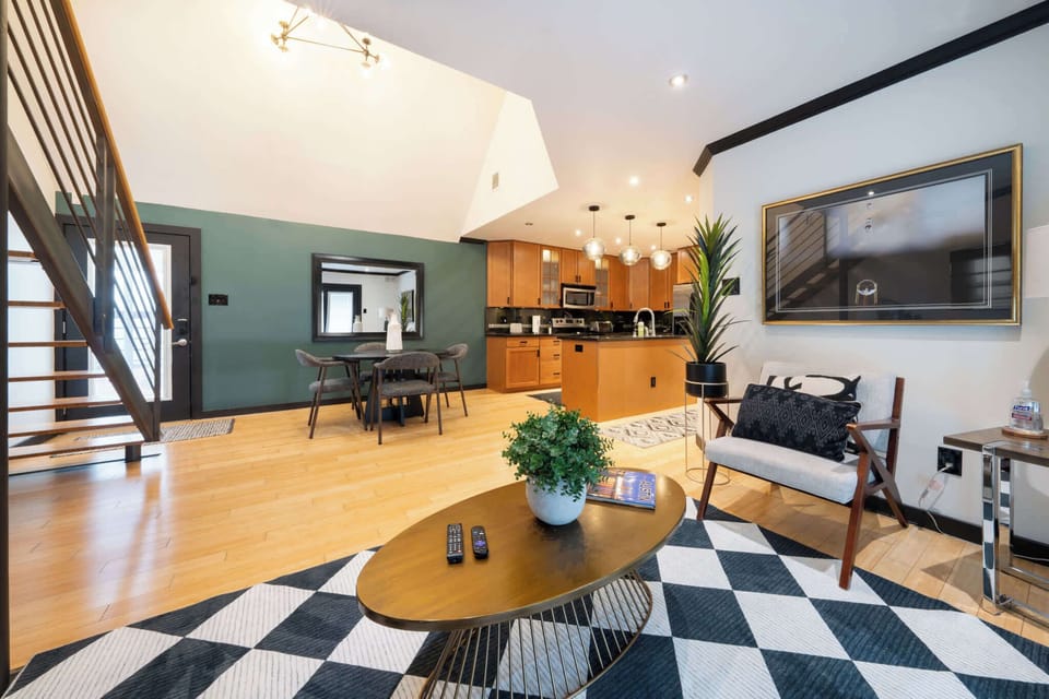 Spacious and stylish living area with modern kitchen, perfect for relaxing and entertaining.