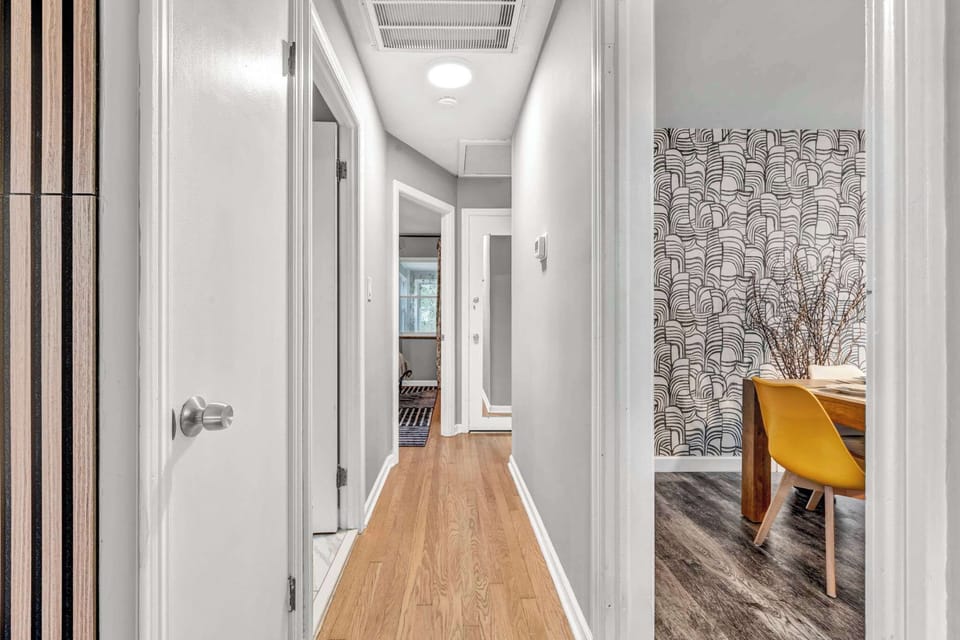 Wander the wood-floored hallway lined w/ eye-catching patterned walls