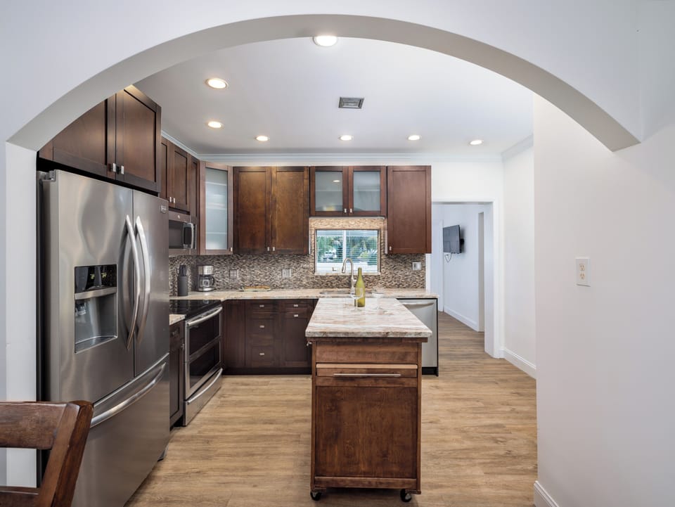 Prepare your favorite meals in this stylish space, offering plenty of counter space, sleek appliances, and the perfect backdrop for your vacation